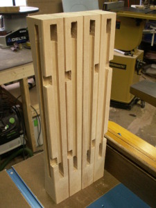 Mortises for frame, grooves for panels and slots for drawer supports in legs