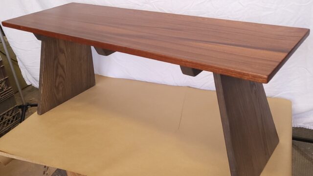 "Flying buttress" coffee table or bench. Sapele top with ash base.